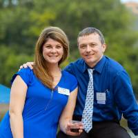 A couple posing by the Grand River.